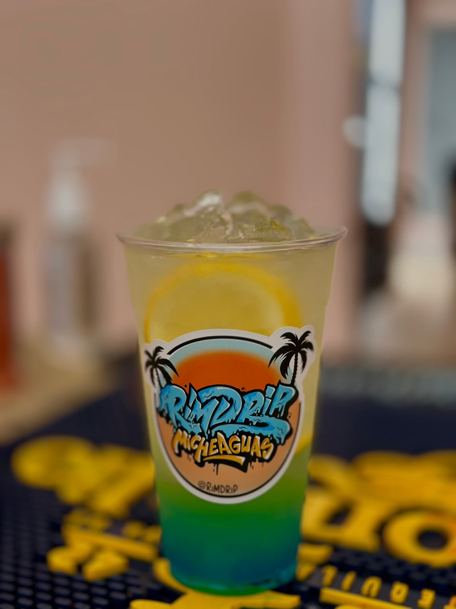 Rimdrip MicheAguas tropical drink with a custom sticker