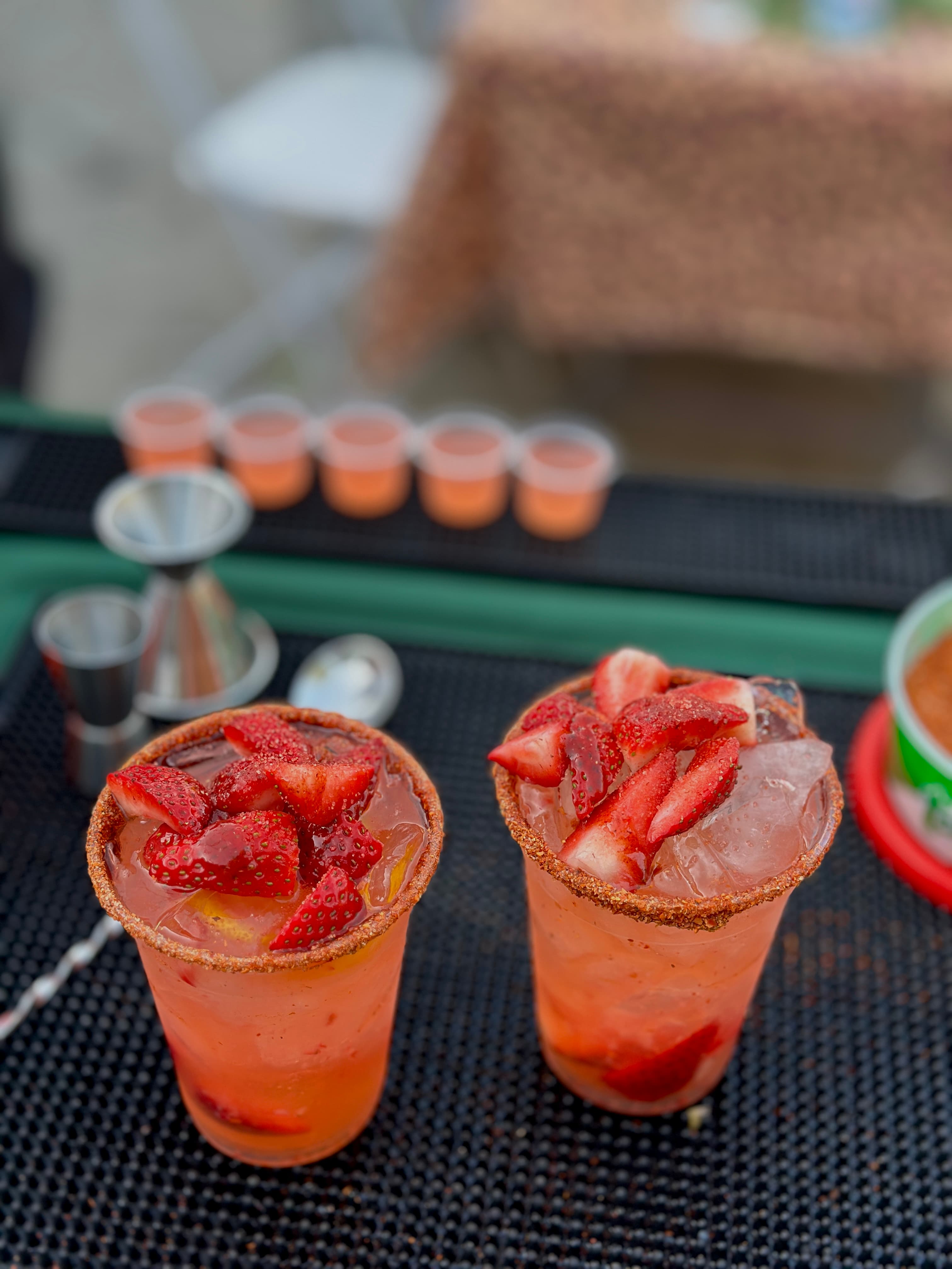 Strawberry micheladas with chamoy rim served at a SoCal event